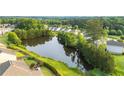 Scenic view of the backyard pond, providing a serene and picturesque backdrop to the property at 1838 Lakeview Bend Way, Buford, GA 30519