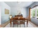 Traditional dining room features natural light, a wood table with seating for four and beautiful decor elements at 1417 Woodrow Kay Rd, Rockmart, GA 30153