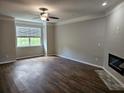 Spacious living room with luxury vinyl plank flooring and a modern fireplace at 2137 Meadow Peak Rd, Duluth, GA 30097