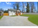 Well-maintained home with a lovely front yard, spacious driveway and inviting entrance at 3470 Glenwood Rd, Decatur, GA 30032