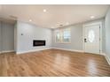 Bright living room featuring hardwood floors, a modern fireplace, and plenty of natural light at 3470 Glenwood Rd, Decatur, GA 30032