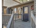 View of the front door and porch with decorative wreath and multiple panes of glass at 3966 N Indian Nw Cir, Kennesaw, GA 30144
