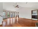 Spacious living room with gleaming hardwood floors, high ceilings, and an abundance of natural light at 3966 N Indian Nw Cir, Kennesaw, GA 30144