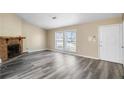 Spacious living room boasts gray wood floors and ample natural light at 5422 Timor Trl, Lithonia, GA 30038