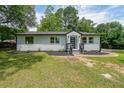 Charming single-story home with a well-manicured lawn and newly mulched flower beds at 2621 Gordon Se Cir, Smyrna, GA 30080