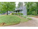 Two-story home with a covered front porch, dormer windows, and well-maintained landscaping at 859 Sangria Ct, Lawrenceville, GA 30043