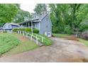 Two-story home with a driveway leading to a garage and a well-maintained lawn at 859 Sangria Ct, Lawrenceville, GA 30043