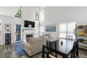 Bright living room with high ceilings, fireplace, large windows and elegant decor at 2061 Pinnacle Pointe Dr, Norcross, GA 30071