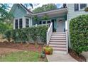Inviting front entrance with a well-maintained lawn and decorative shrubbery leading to the front door at 368 Lambeth Dr, Hiram, GA 30141