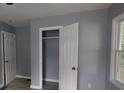 Cozy bedroom features an open closet and modern interior paint creating a relaxing private space at 81 Burbank Nw Dr, Atlanta, GA 30314