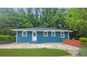 Features a well-maintained lawn, brick wall, and a charming exterior at 81 Burbank Nw Dr, Atlanta, GA 30314