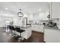 Bright kitchen featuring granite counters, stainless appliances, and an open layout at 912 Ira Sw St, Atlanta, GA 30310