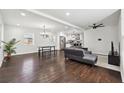 Open-concept living and dining area with hardwood floors and ample natural light at 912 Ira Sw St, Atlanta, GA 30310