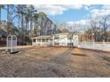 A cozy residence featuring a welcoming front porch, set in a spacious, well-kept yard at 2248 Bethel Rd, Conyers, GA 30012