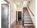 Bright foyer with hardwood floors, staircase and entry to other rooms at 1250 Oxley Nw Ln, Atlanta, GA 30307