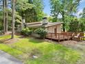 Charming single-story home with a well-maintained lawn and mature trees enhancing its curb appeal at 609 Redwood Drive Dr, Woodstock, GA 30189
