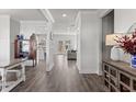 Bright foyer featuring hardwood floors, white trim, and an open view to the living spaces at 242 Crestbrook Ln, Dallas, GA 30157