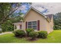 This single Gathering home has manicured landscaping and a charming architectural design at 3673 Jervis Ct, Rex, GA 30273