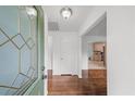 Entryway featuring hardwood floors, a leaded glass door, and access to the kitchen at 2045 Sherwood Se Dr, Marietta, GA 30067