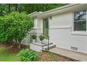 Inviting entrance with steps, iron railing and a green front door at 2045 Sherwood Se Dr, Marietta, GA 30067