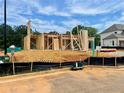 New home construction showing the wood framing on a lot in a new community at 675 Crest Line Trl, Powder Springs, GA 30127