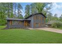 Charming two-story home boasts a beautifully landscaped yard and a freshly sealed driveway at 336 Fond Du Lac Dr, Stone Mountain, GA 30088