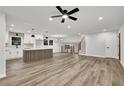 Spacious open-concept kitchen featuring a large island with seating and modern appliances at 336 Fond Du Lac Dr, Stone Mountain, GA 30088
