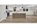 Modern kitchen with white cabinetry, quartz countertops and a decorative kitchen island at 336 Fond Du Lac Dr, Stone Mountain, GA 30088