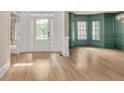 Spacious foyer with hardwood floors and a grand front door with sidelights at 3451 Falls Branch Ct, Buford, GA 30519