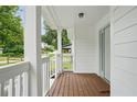 Inviting front porch with wood flooring and white railing, perfect for relaxing at 1245 Ladd Sw St, Atlanta, GA 30310