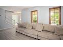 Bright living room with a comfortable sofa and attractive flooring at 2889 Carrousel Ct, Stone Mountain, GA 30087