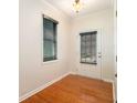 Bright entryway with hardwood floors, a window with blinds, and a door with a window leading to the outside at 5621 Cobblestone Creek Ave # 14, Mableton, GA 30126