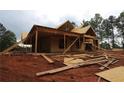 Exterior view of a two-story home under construction, featuring wood framing and an incomplete lawn at 578 Price Rd, Carrollton, GA 30116