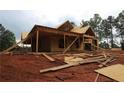 Exterior view of a two-story home under construction, featuring wood framing and an incomplete lawn at 578 Price Rd, Carrollton, GA 30116