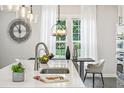 Bright kitchen featuring stainless appliances, white countertops, and modern lighting at 1174 City Park Ln, Decatur, GA 30033