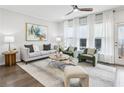 Bright living room with stylish seating, ceiling fan, and bright windows at 1174 City Park Ln, Decatur, GA 30033