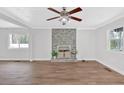 Bright living room features hardwood floors, a decorative fireplace, and ample natural light at 3640 Silver Leaf Sw Ln, Marietta, GA 30008