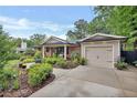Lovely front yard with manicured landscaping, a brick home, and an attached garage at 236 Ridge Nw Ave, Marietta, GA 30064