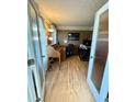 Cozy home office space with wood laminate flooring, featuring natural light at 25 Jessamine Trail Trl, Lawrenceville, GA 30046
