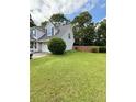 Expansive backyard with lush green lawn, offering plenty of space for outdoor activities at 25 Jessamine Trail Trl, Lawrenceville, GA 30046