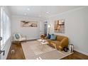 Bright living room with hardwood floors, neutral paint, and modern furnishings at 1398 Woodland Ave, Atlanta, GA 30316