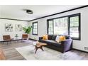 Comfortable living room with a sofa, large windows offering plenty of natural light, and contemporary décor at 2343 Dawn Dr, Decatur, GA 30032