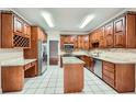 Spacious kitchen with custom wood cabinets, granite countertops, and stainless steel appliances at 7155 Roswell Rd # 58, Atlanta, GA 30328