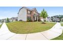 A spacious lawn surrounds this traditional brick home, offering great curb appeal at 2537 Sori Dr, Buford, GA 30519