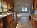 Functional kitchen with plenty of cabinet space and an adjoining living area at 7217 Union Grove Rd, Lithonia, GA 30058