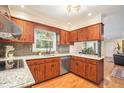 Well-appointed kitchen with granite countertops, stainless steel appliances, and custom cabinetry at 733 Huntington Se Pl, Marietta, GA 30067