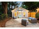 Outdoor patio space with stylish furniture, perfect for entertaining guests on warm nights at 1583 Braeburn Se Dr, Atlanta, GA 30316