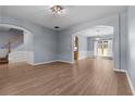 Open-concept living room with archways, hardwood floors, and natural light enhancing the space at 211 Augusta Woods Dr, Villa Rica, GA 30180