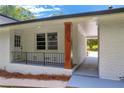 Inviting covered porch with classic iron railing, perfect for enjoying the outdoors at 2678 Rainbow Forest Dr, Decatur, GA 30034