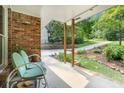 Cozy covered porch featuring comfortable green chairs, perfect for relaxing and enjoying the view at 1706 Remington Rd, Atlanta, GA 30341